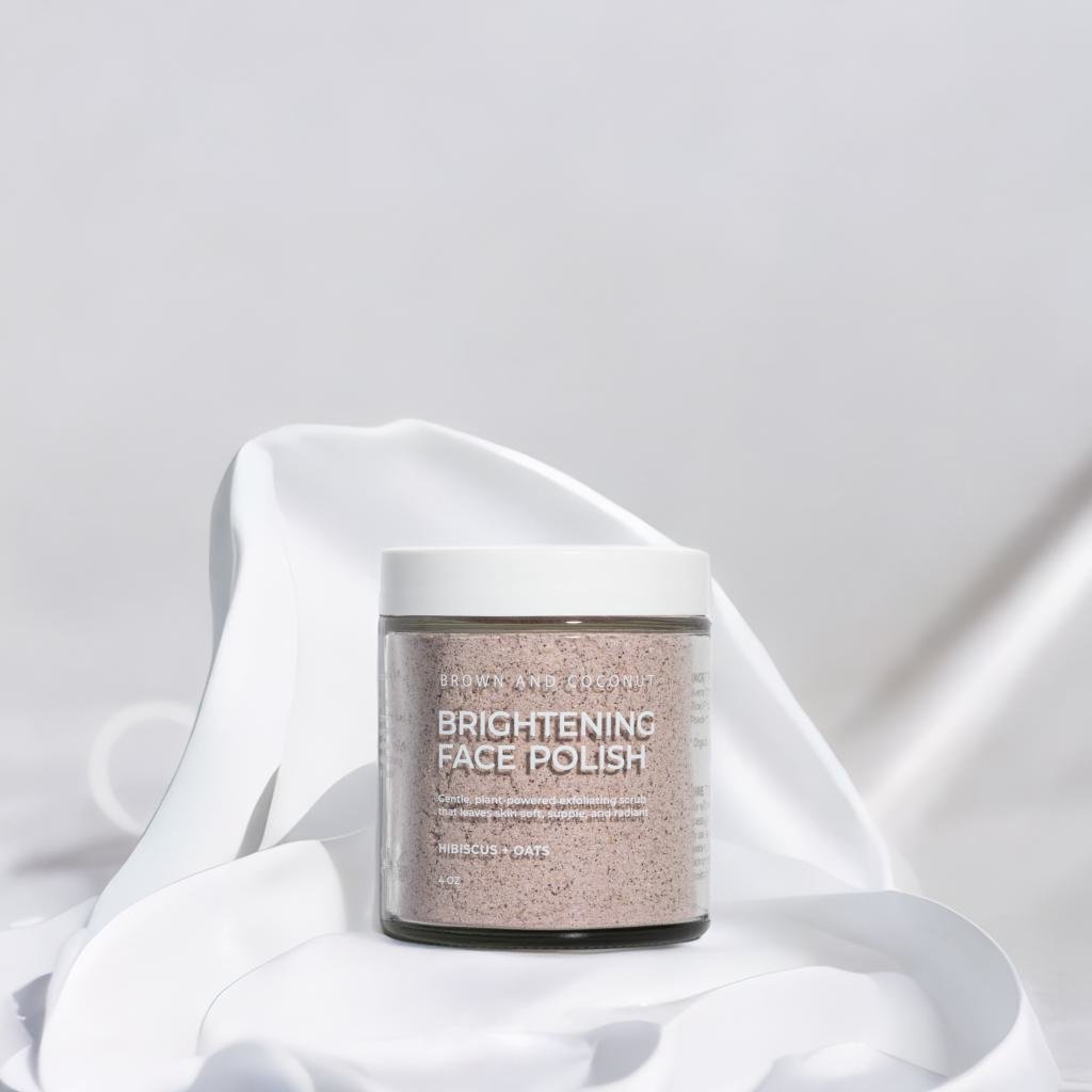 Brown and Coconut Brightening Face Polish on white satin