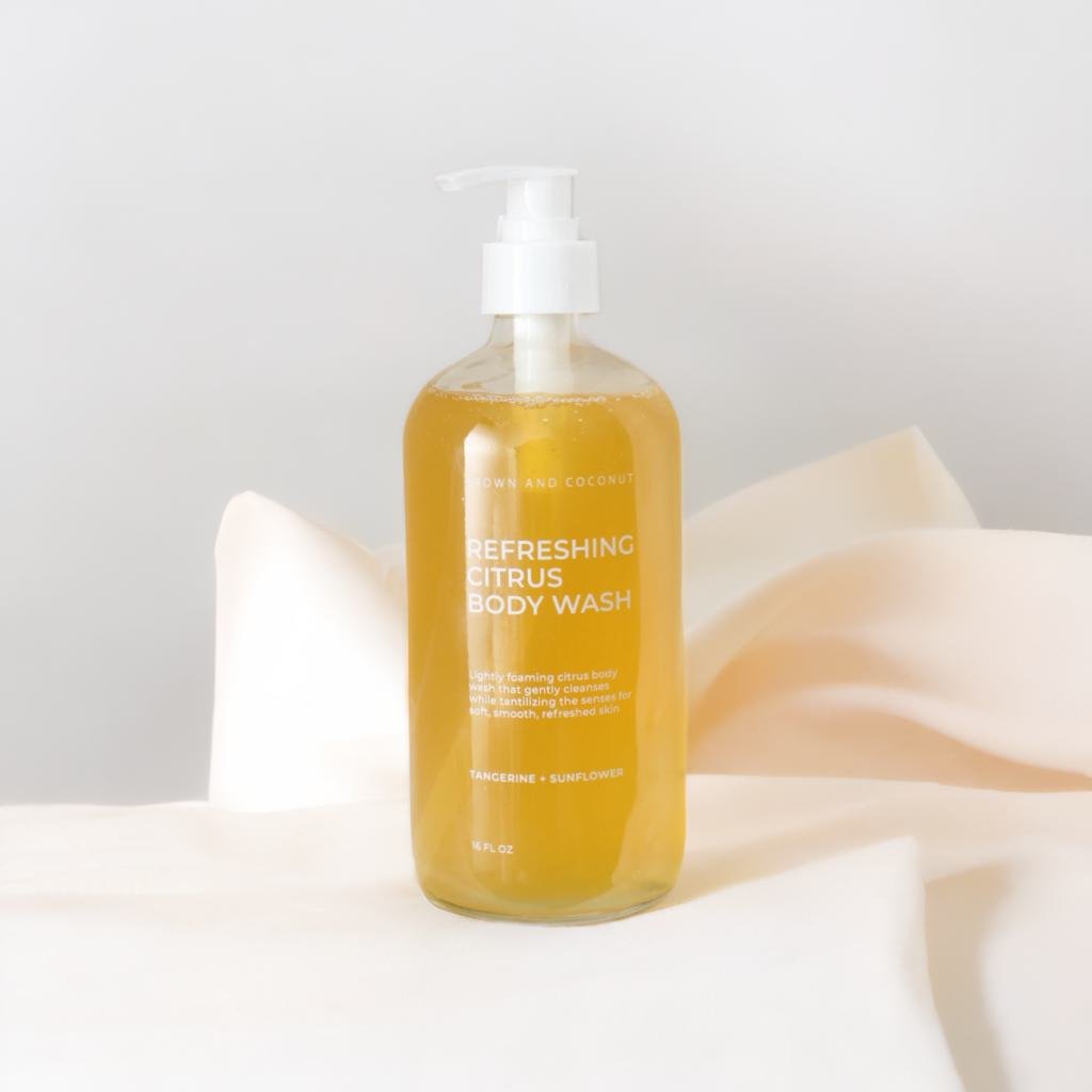 Brown and Coconut Refreshing Citrus Body Wash on Cream Background