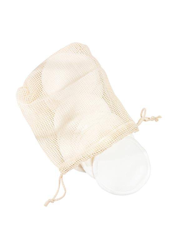 Brown and Coconut Reusable Cotton Rounds coming out of mesh bag on white background